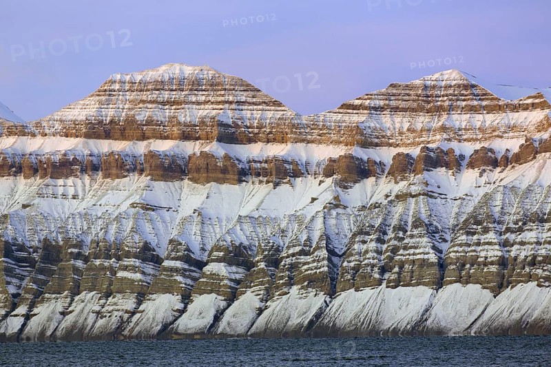 Snow covered Carboniferous mountain slope showing strata in autumn, Billefjord, Billefjorden, Svalbard, Spitsbergen, Norway, Europe