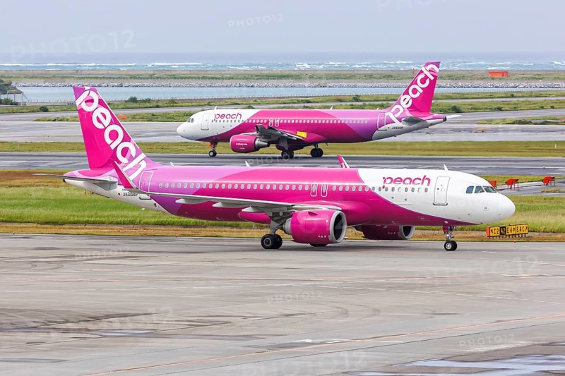 Airbus A320 Peach aircraft with registration JA204P at Okinawa Airport (OKA) in Naha, Japan, Asia