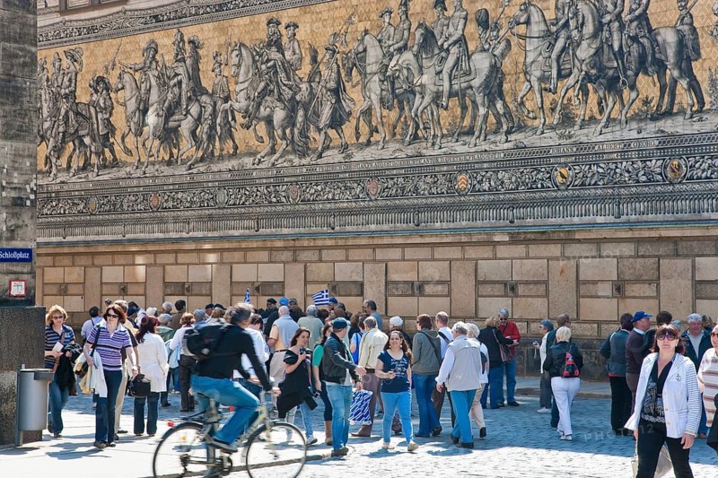 Procession of princes with tourists, the Procession of Princes in Dresden, is the world's largest mural made of Meissen porcelain tiles and depicts the ancestral gallery of the Wettin sovereigns with their retinue