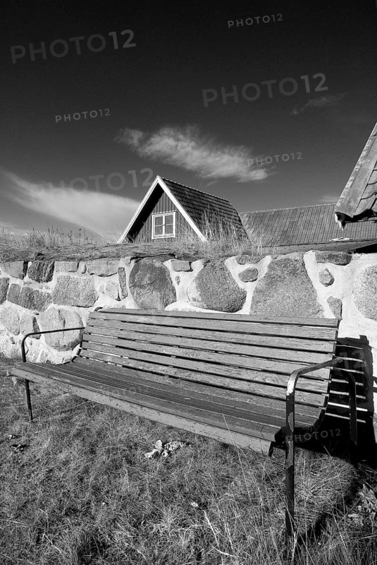 Park bench, bench, wooden bench in front of a wooden house in Karlskrona, Sweden, Europe