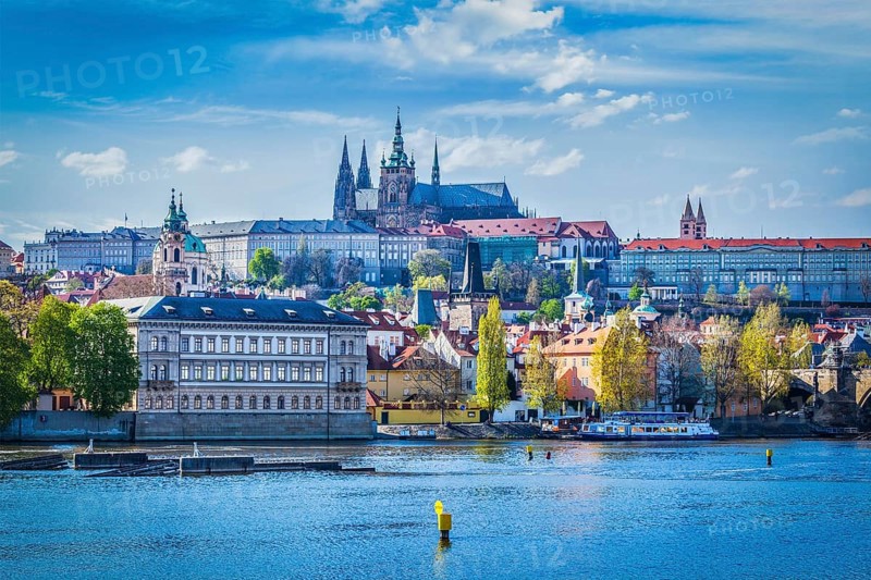 View of Gradchany Prague Castle and St. Vitus Cathedral in daytime over Vltava river