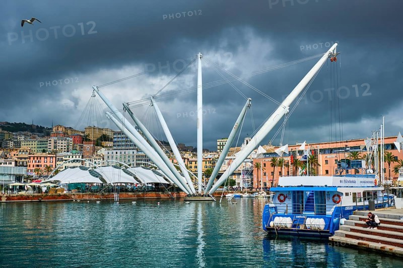 Genoa, Italy, April 26, 2019: Port of Genoa (Genova) Old Port Porto Antico with yachts and boats with stormy sky. Genoa, Italy, Europe