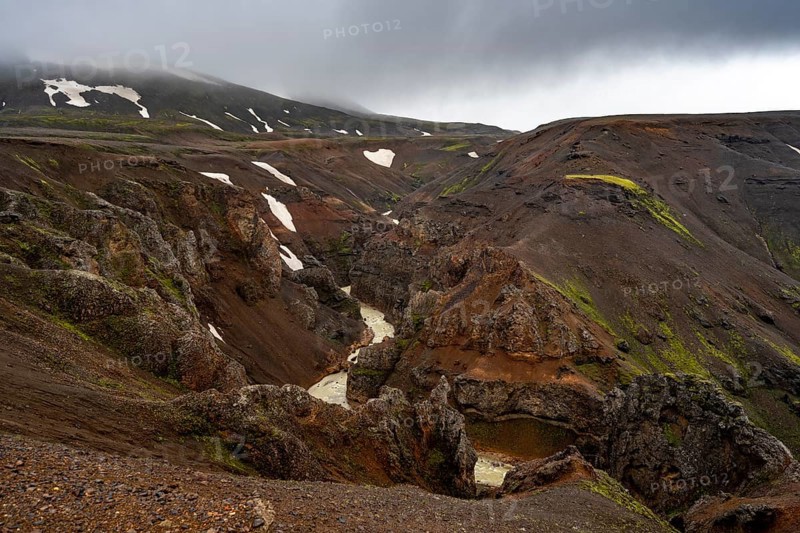 River in a gorge, foot of Asgardsa, volcanic landscape with black and red rocks, Kerlingarfjöll, Icelandic highlands, Iceland, Europe