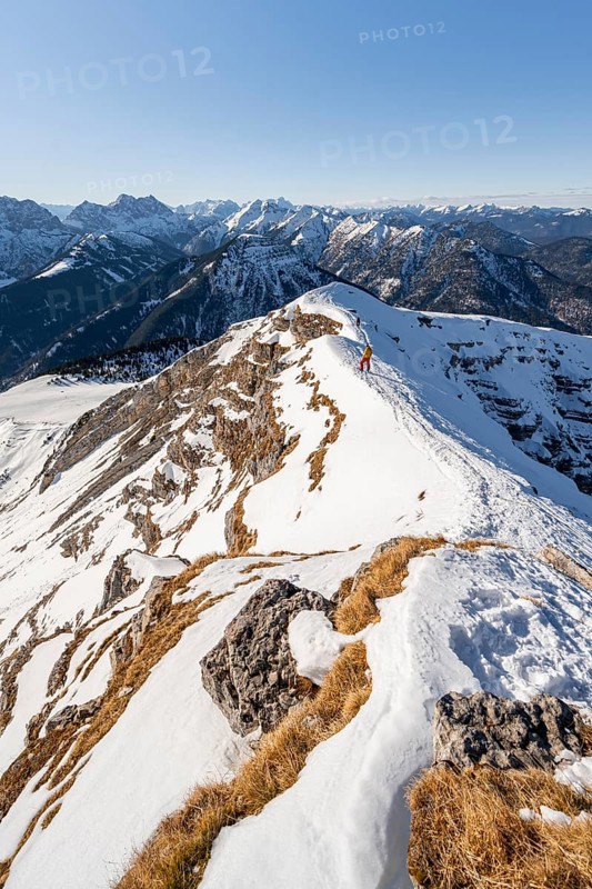Ski tourers at the summit of Schafreuter, view of snow-covered mountain panorama, Karwendel, Tyrol, Austria, Europe
