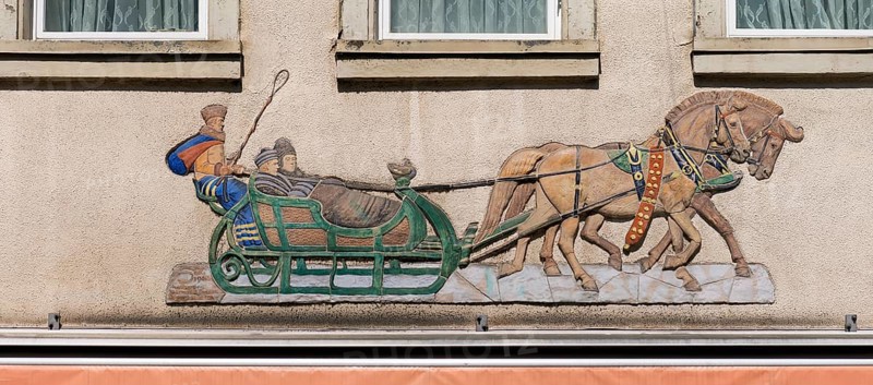 Historical relief on a house facade, people in a horse-drawn sleigh, Emmendingen, Baden-Württemberg, Germany, Europe