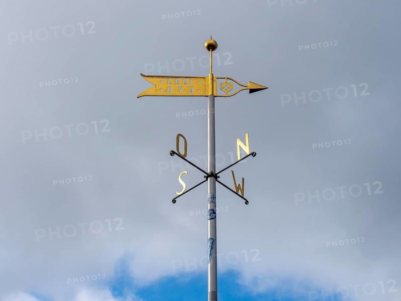 Metal wind arrow and wind chime for indicating cardinal points, north, south, east, west, Germany, Europe