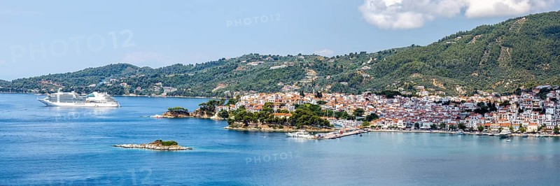Skiathos town with cruise ship holiday by the sea panorama on the Mediterranean island of Skiathos, Greece, Europe