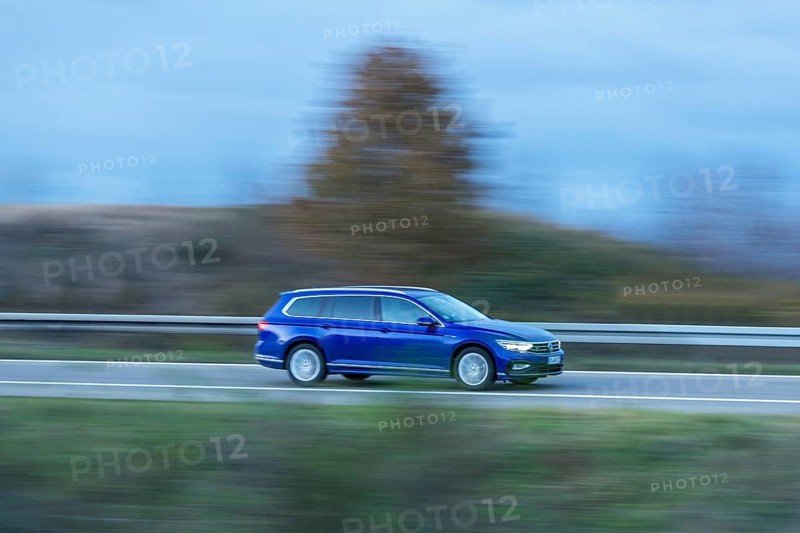 Blue VW Passat Variant driving on a country road, twilight, motion blur, Baden-Württemberg, Germany, Europe