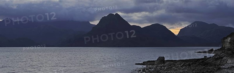 Rain clouds at sunset over the Cuillin Hills, viewed from Elgol on the Island Skye, Inner Hebrides, Scotland, UK