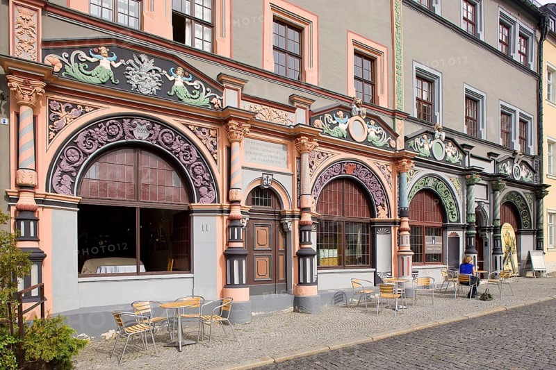 The square was given its distinctive shape in the 16th century by the town house and the semi-detached house to the east, the left half of which is now known as the Cranach House, the Court Pharmacy to the north and the inn Zum Schwarzen Bären to the south.In the centre of the market, the Neptune Fountain
