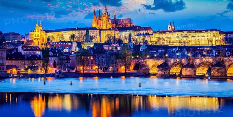 Panorama of Prague Castle and St. Vitus cathedral in twilight with dramatic sky. Prague, Czech Republic, Europe