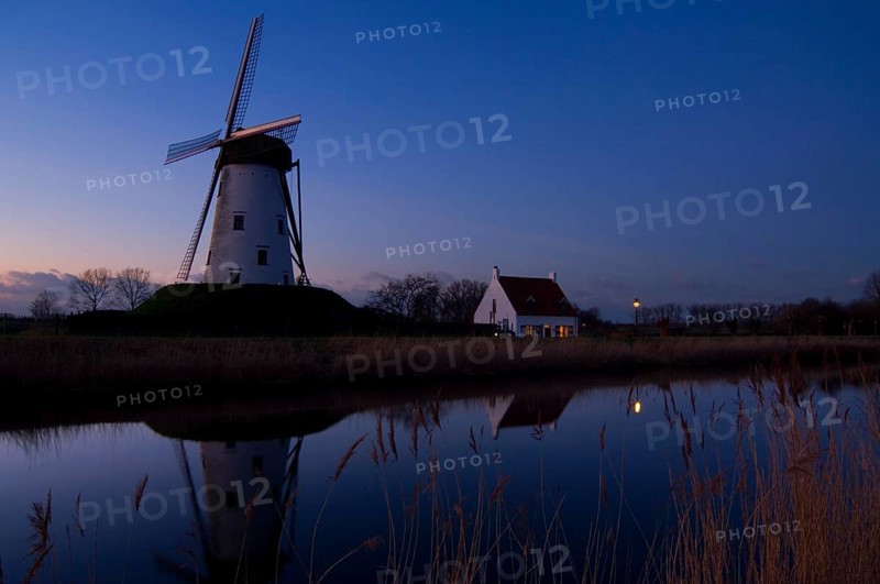 The traditional windmill Schellemolen at sunset along the Damme Canal, Damme, West Flanders, Belgium, Europe