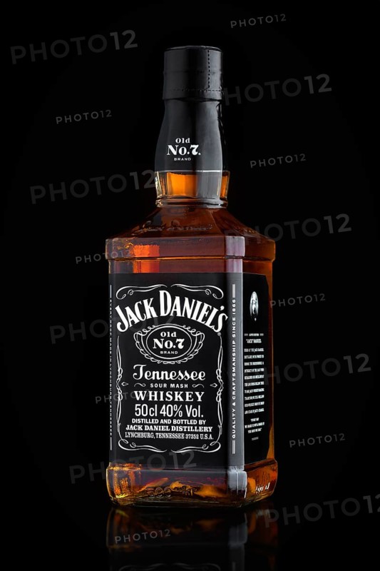 MINSK, BELARUS, OCTOBER 3, 2016: Bottle of Jack Daniel's tennessee sour mash old no. 7 whiskey isolated on black background with reflection. Jack Daniel's is a brand of Tennessee whiskey and the top selling American whiskey in the world