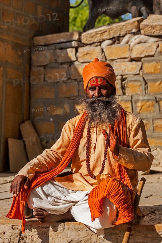 JAISALMER, INDIA, NOVEMBER 28, 2012: Indian sadhu (holy man) blessing. Sadhus are holy men who live ascetic life and focus on spiritual practice of Hinduism