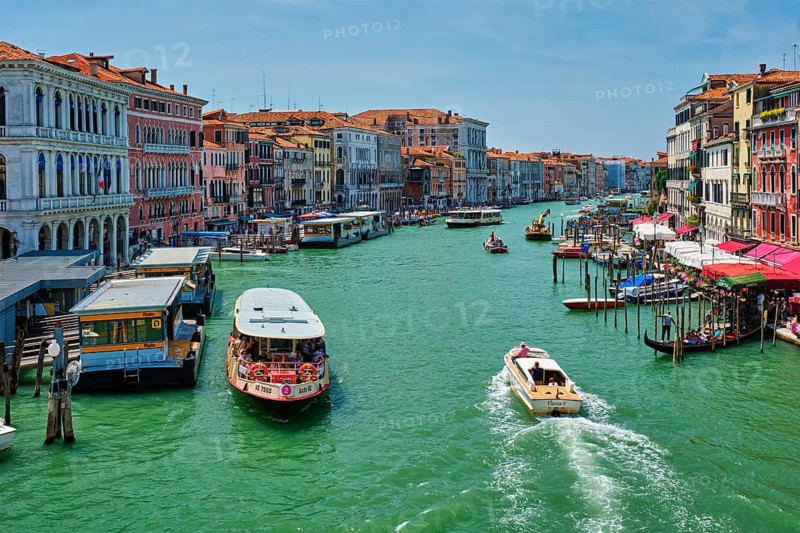 VENICE, ITALY, JULY 19, 2019: Grand Canal with boats, vaporetto and gondolas on sunset from Rialto bridge, Venice, Italy, Europe