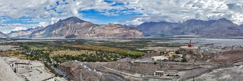 Panorama of Nubra valley in Himalayas with giant Buddha statue in Diskit, Ladakh, India, Asia