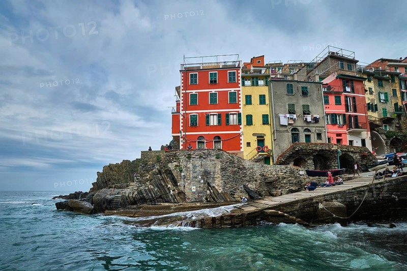 RIOMAGGIORE, ITALY, APRIL 25, 2019: Riomaggiore village popular tourist destination in Cinque Terre National Park a UNESCO World Heritage Site, Liguria, Italy in stormy weather