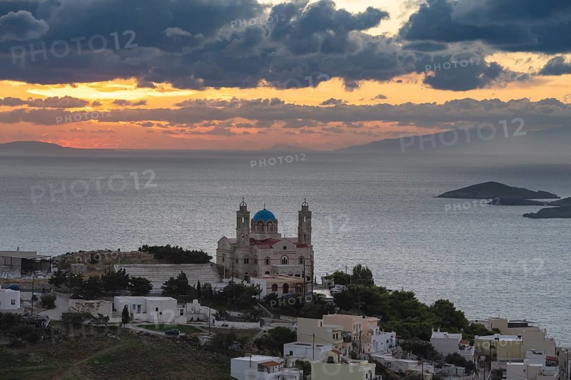 View from Ano Syros to the houses of Ermoupoli with the Anastasi Church or Church of the Resurrection, town view with islands and sea, dramatic cloudy sky at sunrise, Ano Syros, Syros, Cyclades, Greece, Europe