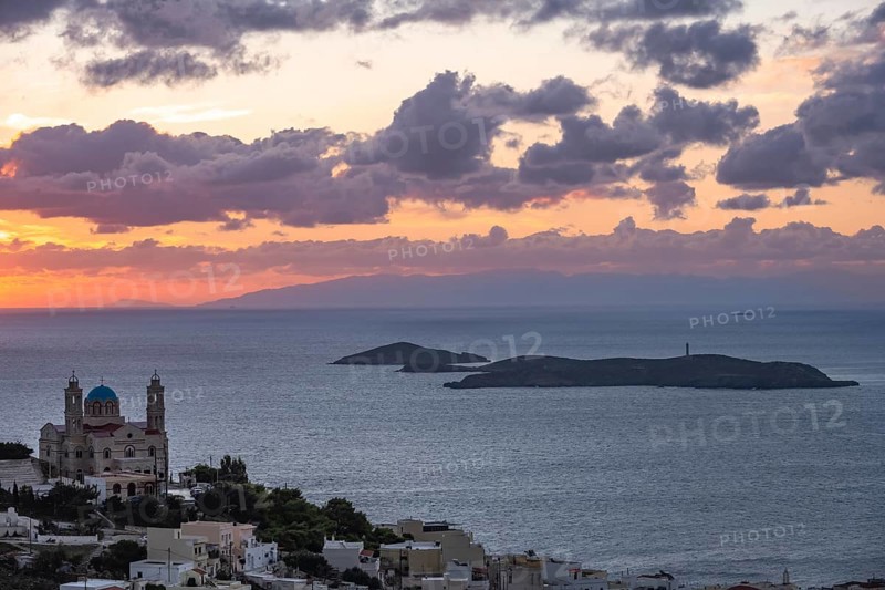View from Ano Syros to the houses of Ermoupoli with the Anastasi Church or Church of the Resurrection, town view with islands and sea, dramatic cloudy sky at sunrise, Ano Syros, Syros, Cyclades, Greece, Europe