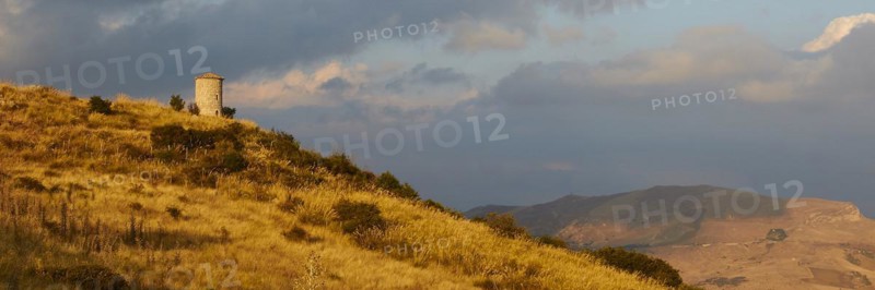 All around, panorama shot, evening light, autumn hill landscape, brown fields, dramatic cloudy sky, Madonie National Park, autumn, late summer, Sicily, Italy, Europe