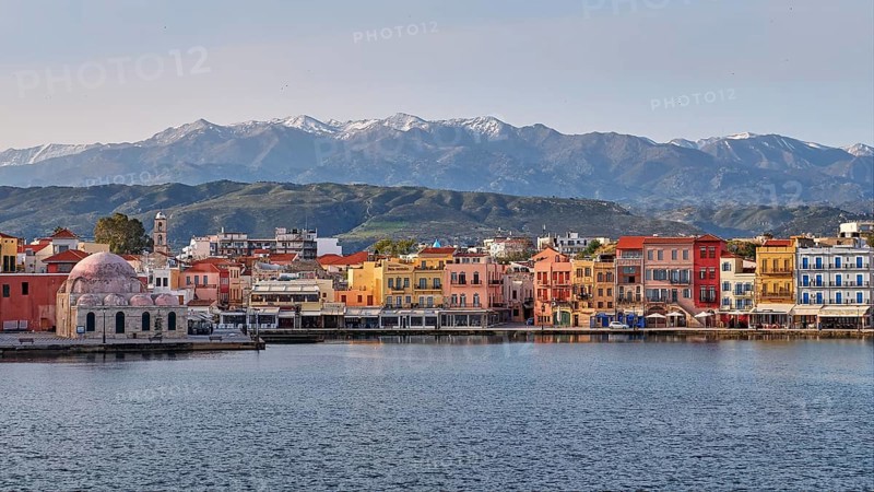 Lefka Ori, White Mountains, Snowy Mountains, Venetian Old Town, Venetian Harbour, Row of Houses, Colourful Houses, Calm Sea, Grey Blue Sea, Blue Cloudless Sky, Chania, West Crete, Island of Crete, Greece, Europe