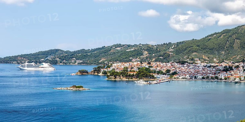 Skiathos town with cruise ship holiday by the sea panorama on the Mediterranean island of Skiathos, Greece, Europe