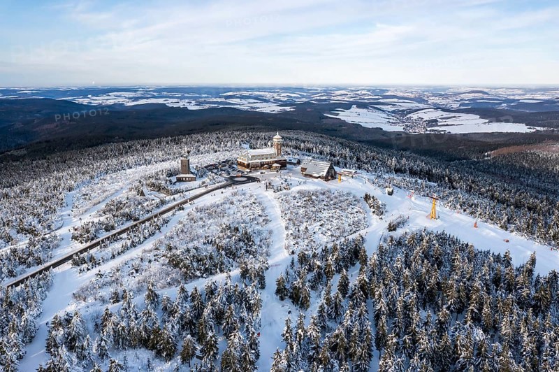 Fichtelberg highest mountain in the Ore Mountains in winter aerial view in Oberwiesenthal, Germany, Europe