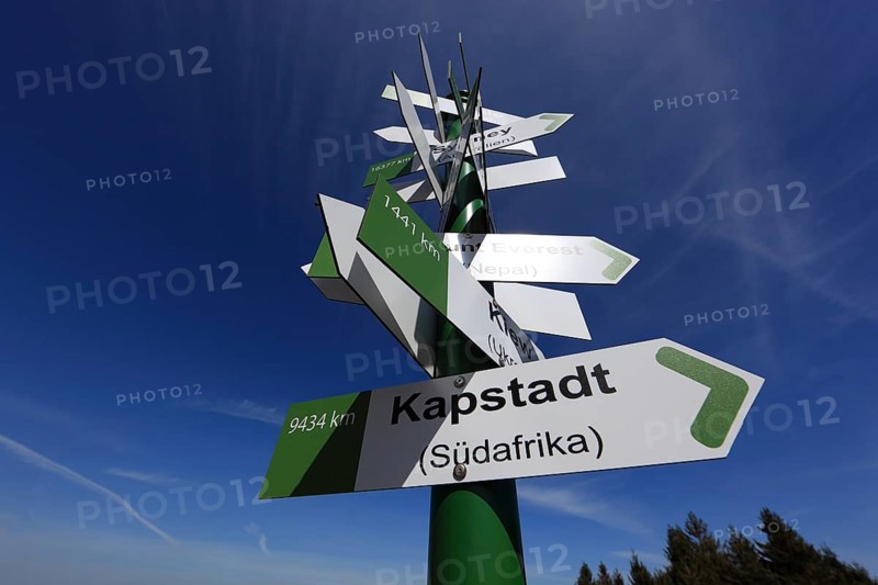 World signpost, Noah's Sails lookout tower on Ellenbogen, 813 m. high mountain in the Rhön in the Schmalkalden-Meiningen district, Thuringia, Germany, Europe