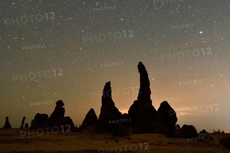 Starry sky above the mystical rock formations of Gharameel, AlUla region, Medina province, Saudi Arabia, Arabian Peninsula, Asia