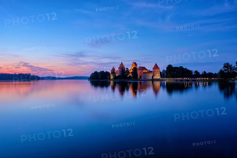 Trakai Island Castle in lake Galve illuminated in night, Lithuania, Europe