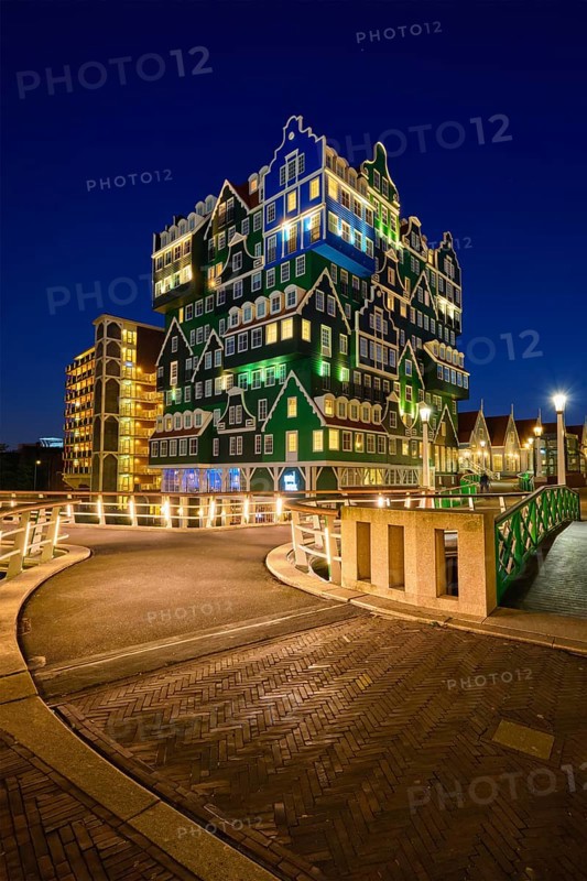 ZAANDAM, NETHERLANDS, MAY 8, 2017: Inntel Hotel in Zaandam illuminated at night. Design of 12-storey tall building opened in 2009 is the result of stacking a series of traditional Dutch houses