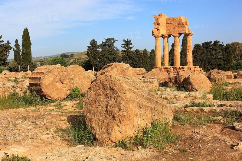 In the Parco Valle dei Templi di Agrigento, Unesco World Heritage Site, remains of the ancient city of Akragas in the Valley of the Temples of Agrigento, remains of the Temple of Dioscuri at Porta V, Sicily, Italy, Europe