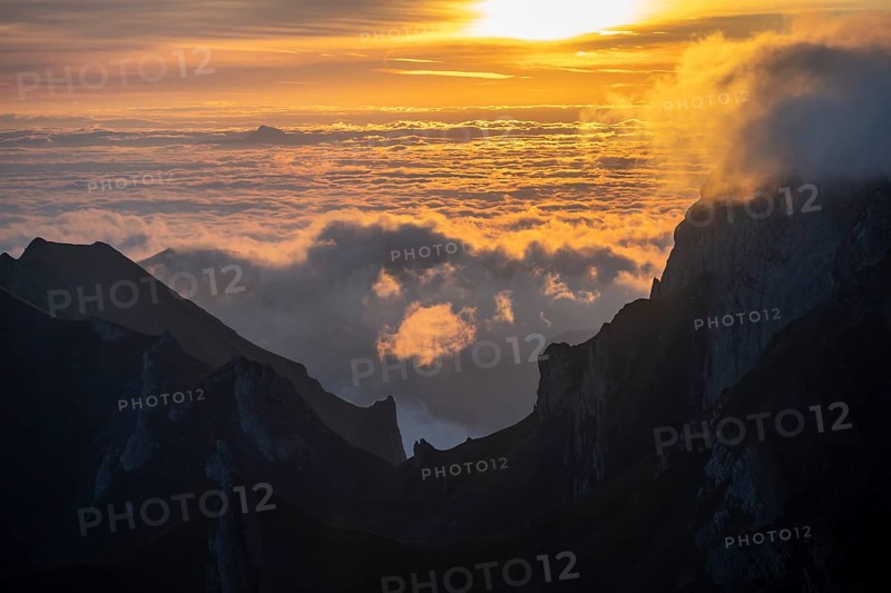 Sunrise, sun shining over mountains in fog, Säntis, Appenzell Ausserrhoden, Appenzell Alps, Switzerland, Europe