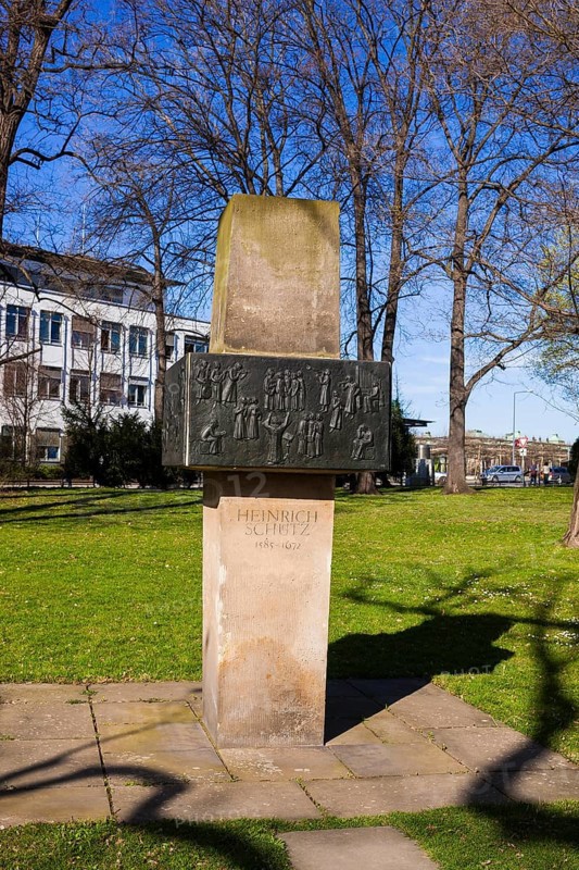 In Dresden, not far from the Zwinger in the green space west of the Zwinger pond, a stele erected in 1985 commemorates Schütz's work in Dresden. Berndt Wilde created this memorial in 1972, which consists of a sandstone stele on which bronze plaques depicting scenes from Schütz's time are displayed