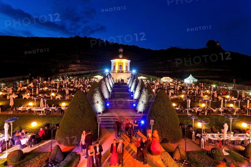 Summer night ball at Wackerbarth Castle. Schloss Wackerbarth or Wackerbarths Ruh' is a baroque castle surrounded by vineyards in the Niederlößnitz district of Radebeul on the road to Meissen, which serves as the seat of the Saxon State Winery. The winery belongs to the large Lößnitz vineyard and is located in the single vineyard Radebeuler Johannisberg