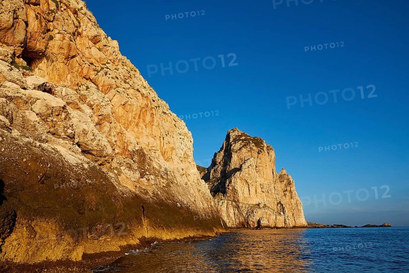 Evening light, Boat tour, View from the sea, Bizarre rock formations, Rugged mountains, Marettimo, Egadi Islands, Sicily, Italy, Europe