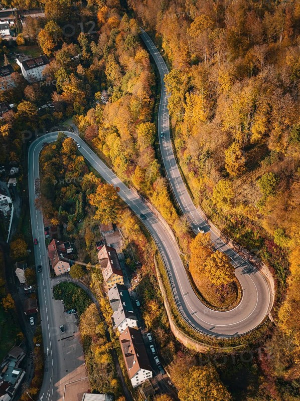 Aerial view S-curve in autumn, Calw, Black Forest Germany
