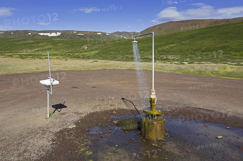 Shower and sink with hot water at Krafla, volcanic caldera in the Myvatn Geothermal Area in summer, North Iceland