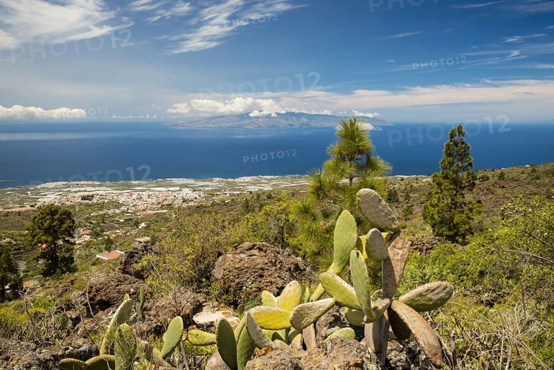 Panorama from Mirador de Chirche over Guia de Isora and Playa de San Juan to the west coast, with the island of Gomera in the background, Tenerife, Canary Islands, Spain, Europe