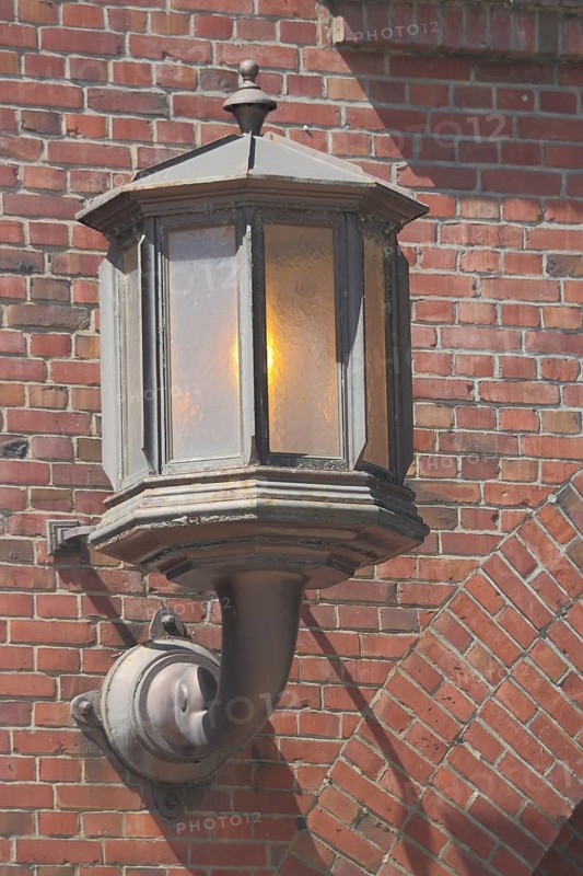 Street lamp with clinker brick at the Adam Opel AG main portal, Rüsselsheim, Rüsselsheim, Hesse, Germany, Europe