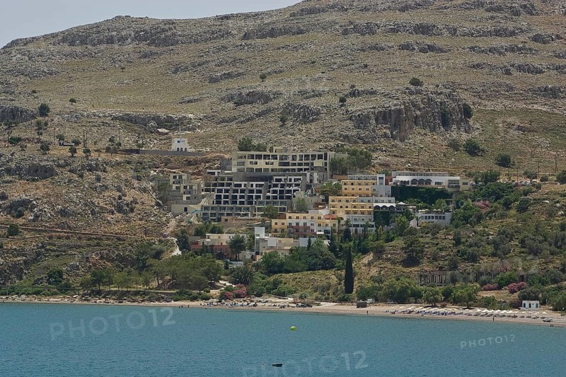Rhodes Island, Lindos, Lindos is a town on the Greek island of Rhodes. Its landmark is the acropolis on a rock with huge archways from the 4th century and reliefs dating from around 280 BC