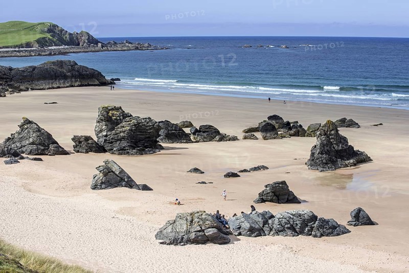 Sandy beach with rocks near Durness, Sutherland, Scottish Highlands, Scotland, UK