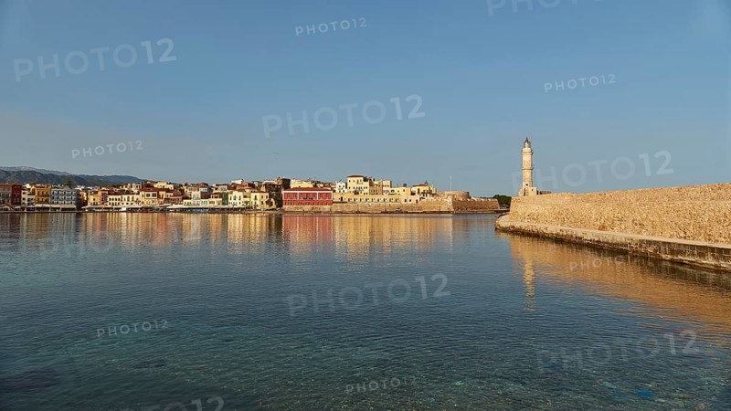 Venetian old town, Venetian harbour, row of houses, colourful houses, Venetian lighthouse, calm sea, blue sea, grey-blue sea, blue cloudless sky, Chania, West Crete, island of Crete, Greece, Europe