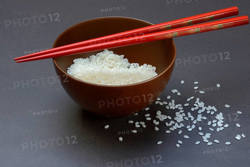 Rice, white rice in bowl with chopsticks, uncooked