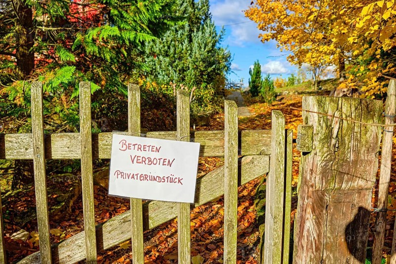 No Trespassing Private Property, sign on a garden gate made of wooden slats