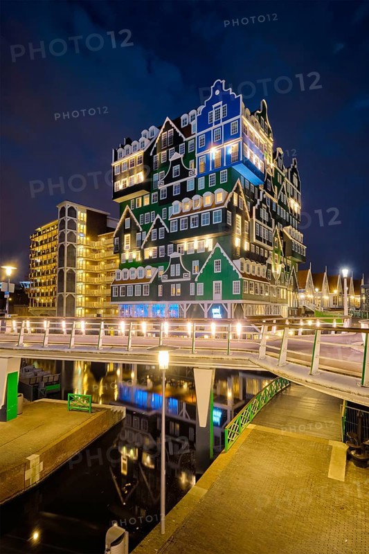 ZAANDAM, NETHERLANDS, MAY 21, 2018: Inntel Hotel in Zaandam illuminated at night. Design of 12-storey tall building opened in 2009 is the result of stacking a series of traditional Dutch houses