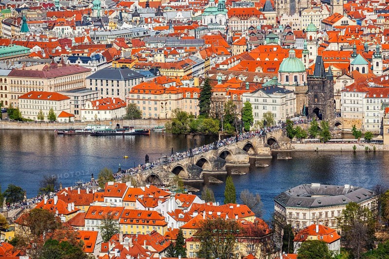 View of Charles Bridge over Vltava river and Old city from Petrin hill Observation Tower. Prague, Czech Republic, Europe