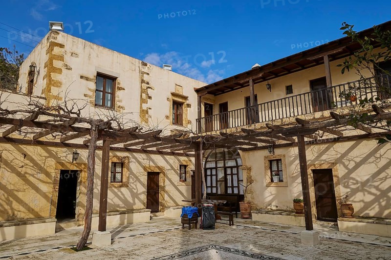 Inner courtyard, grape arbours, building over corner, Panagias, Odigitrias, Gonias, Orthodox Monastery, Crete, Greece, Europe