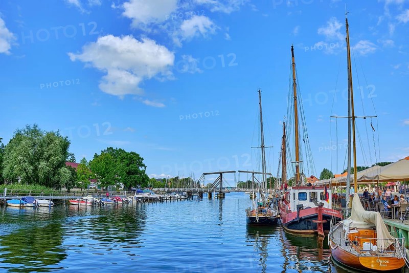 Picturesque view of Greifswald Wieck town harbour with historic wooden bascule bridge over the river Ryck, Hanseatic town of Greifswald, Mecklenburg-Western Pomerania, Germany, Europe