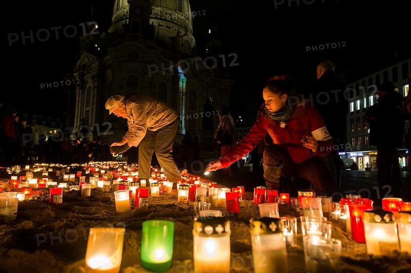 On the 69th anniversary of the Allied bombing of Dresden, Dresdeners commemorate with candles at the Church of Our Lady